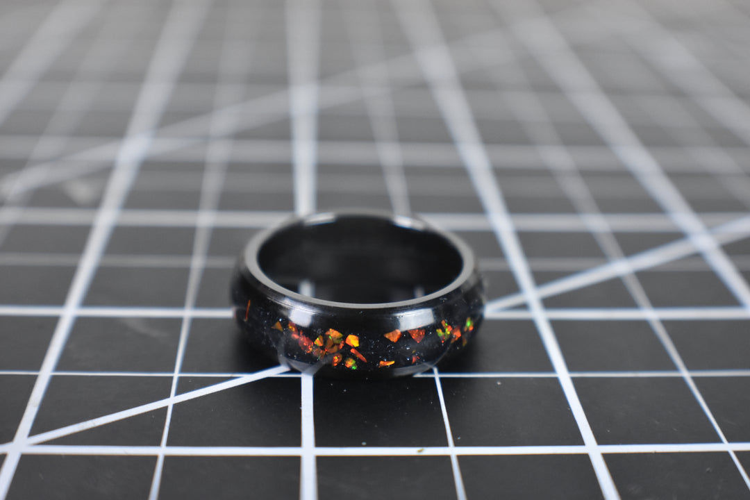 Ceramic band with red and orange opals